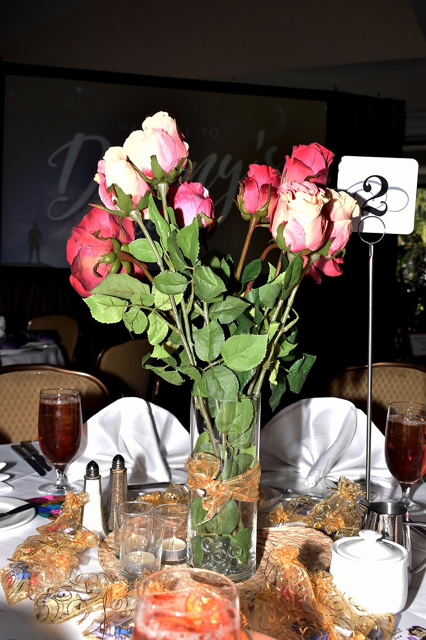 Pink and red roses decorated the centers of tables.