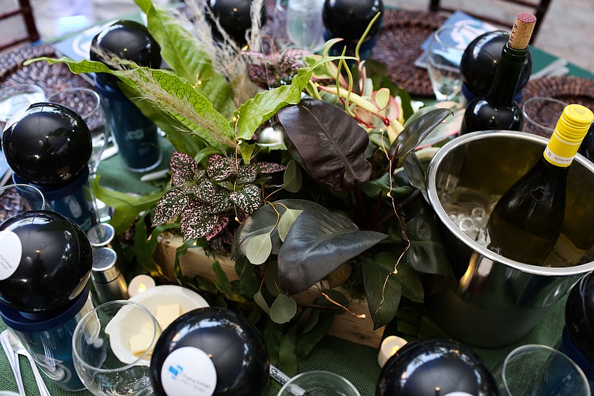Greenery centered the tables.