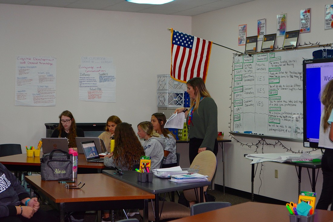 Venice High teacher Mary Dembinski and her students work to plan a supply drive.
