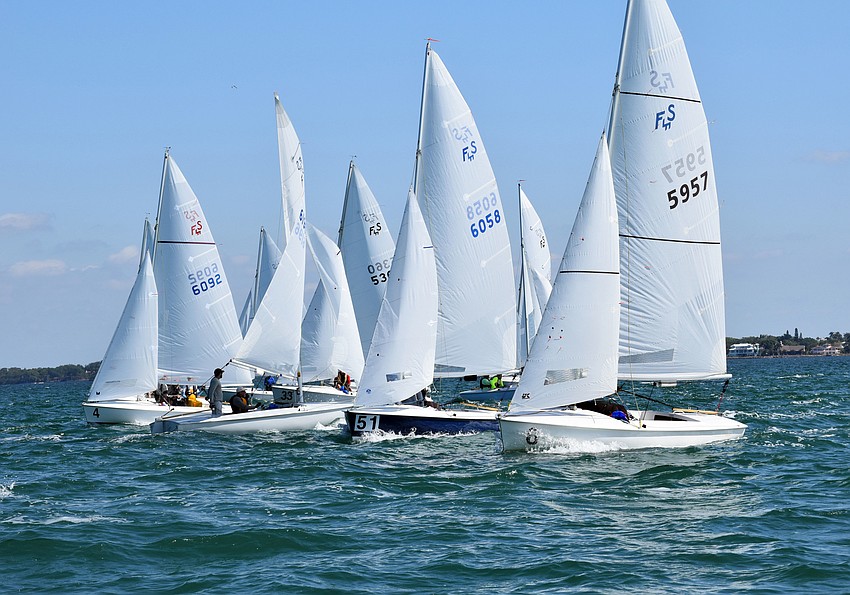Sailors in the championship fleet jockey for a better position.