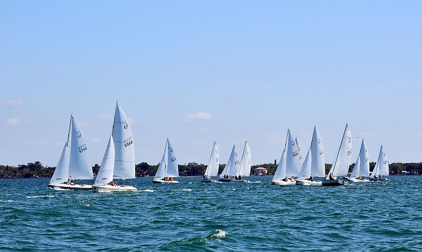 Sailors test out the wind and water before beginning the race.