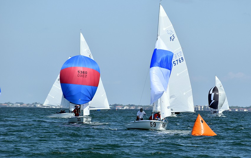 Sailors reach a turning point where they drop their spinnakers.