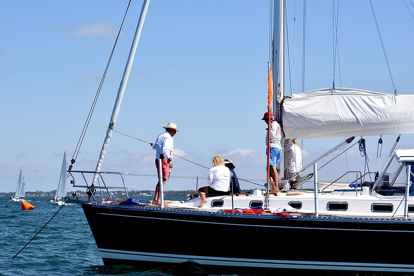 Officials on the signal boat wait for sailors to line up.