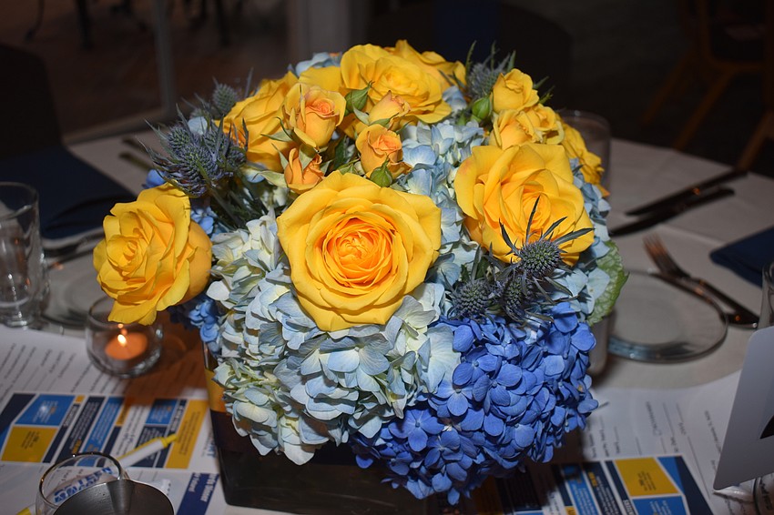 The yellow and blue centerpieces reflect the colors in the logo of the Teen Court of Sarasota.