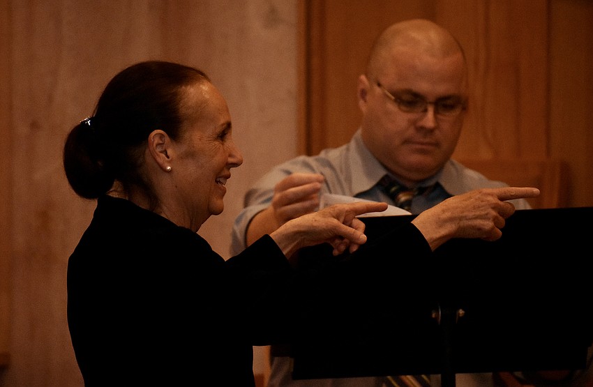 Ann Stephenson Moe, the conductor and artistic director for the choir, smiles as the concert begins.