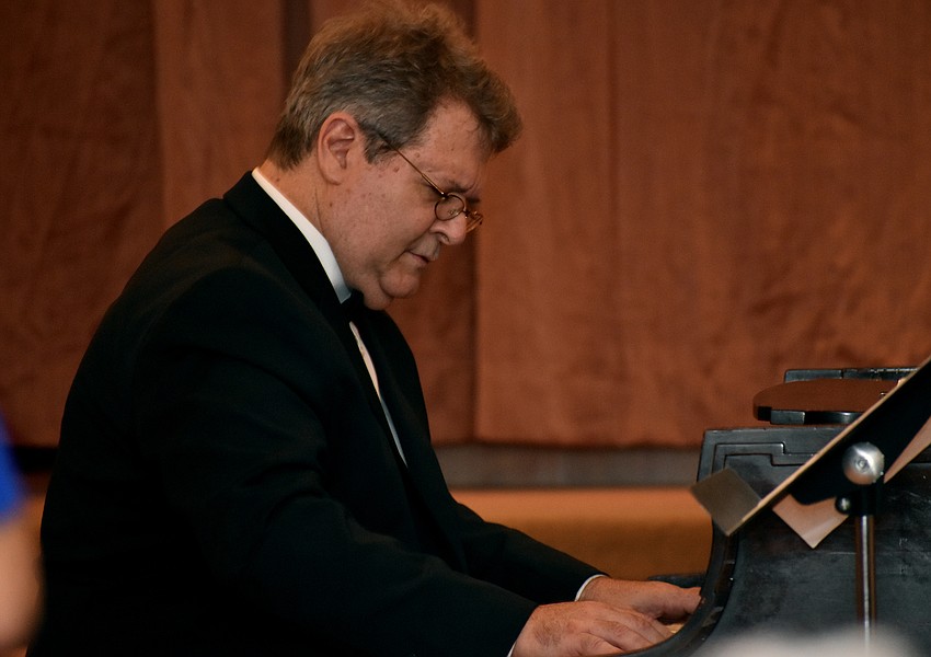 Jonathan Spivey, the resident pianist of the orchestra, performs during the concert.