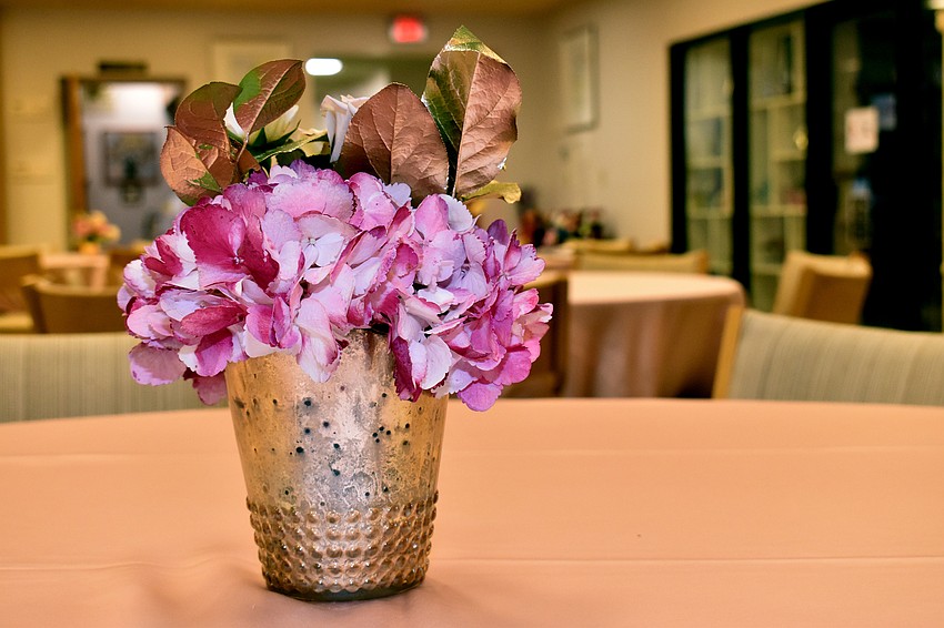 Pink flowers adorned each table during the reception.