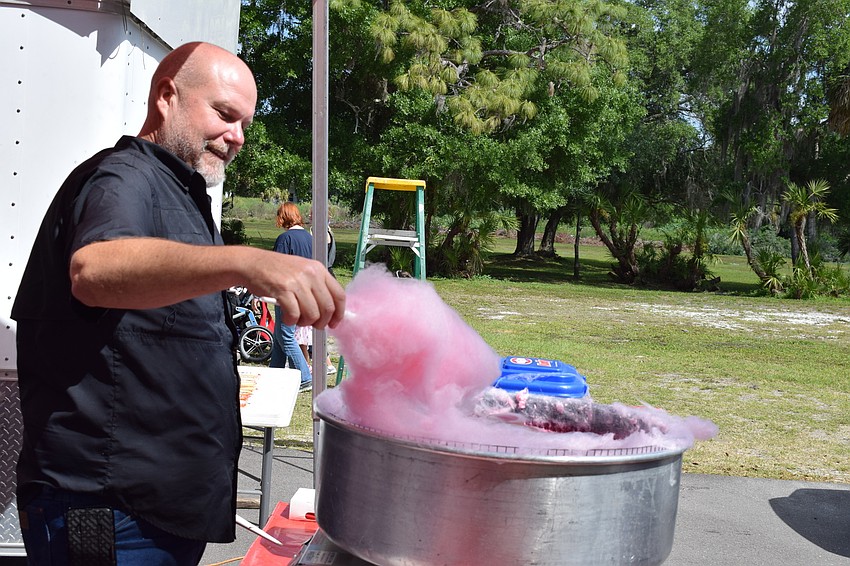 Tom Houser, of Custom Catering, prepares cotton candy.