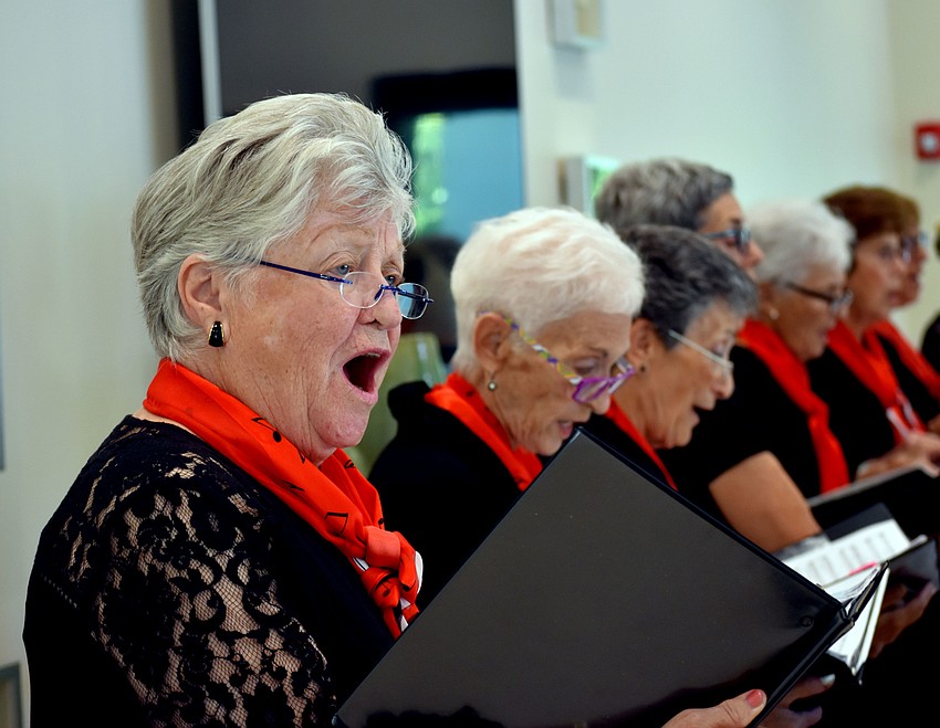 A chorus member belts out 