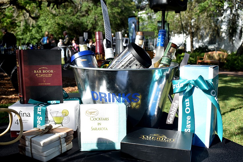 Silent auction items included wine baskets, signed baseballs and bartending baskets.