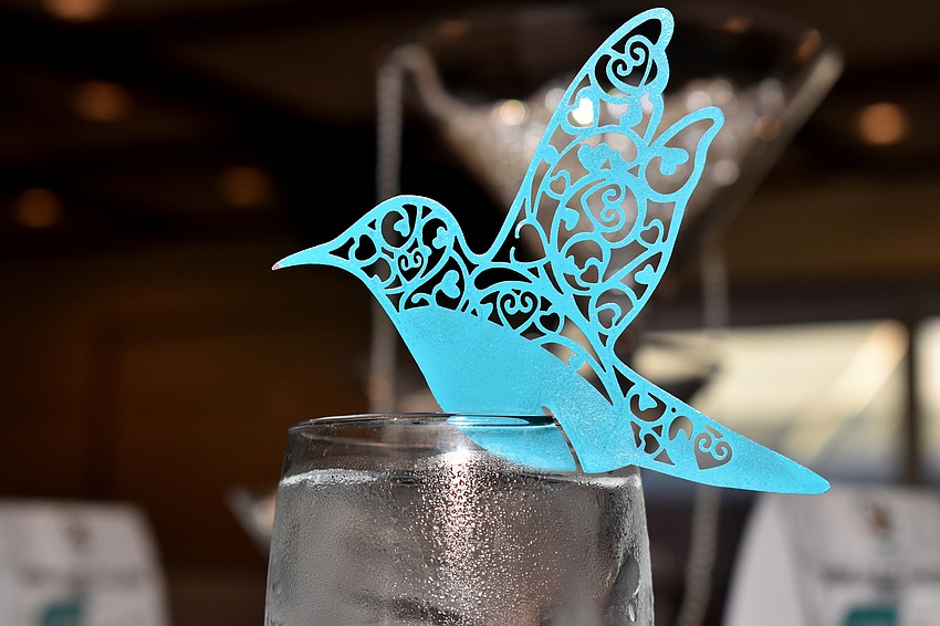 Blue birds were atop each glass.