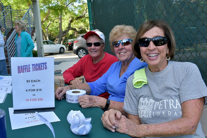 Cathy Powell, Dolores Levy and Fran Harris were all smiles at the raffle table.