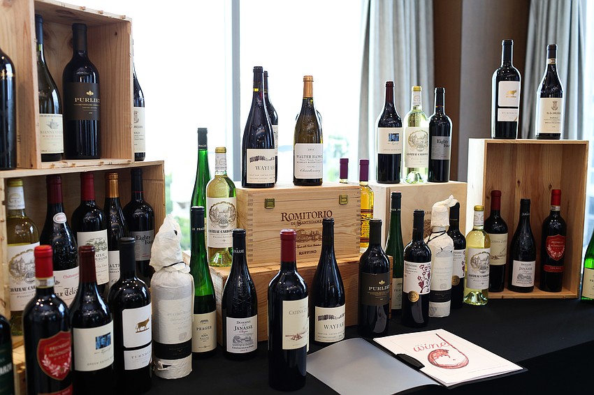 The first live auction item was a wall of wines.