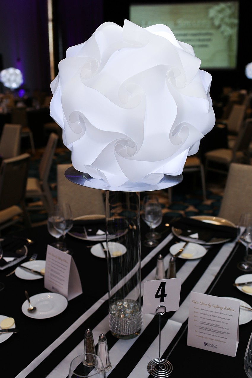 The centerpieces stood tall above the tables.