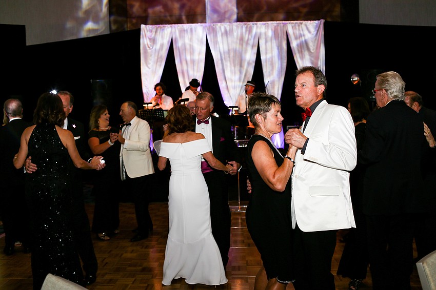 Several brave couples got on the dance floor before dinner.