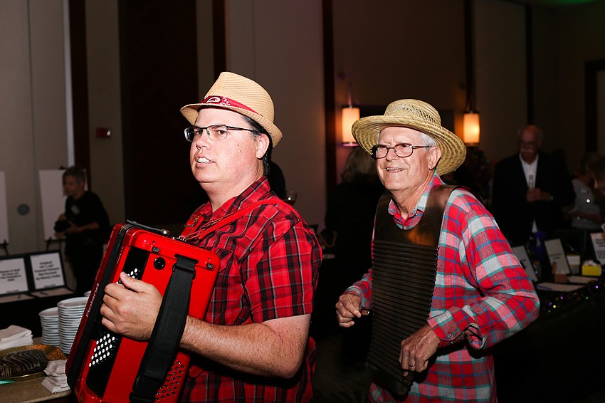 Lyam Langley and Ken Smith played music throughout cocktail hour in their band Gumbo Boogie Band.