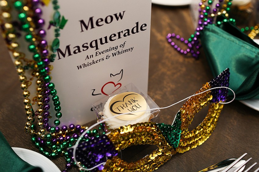 Each guest received traditional Mardi Gras gear at their place setting,