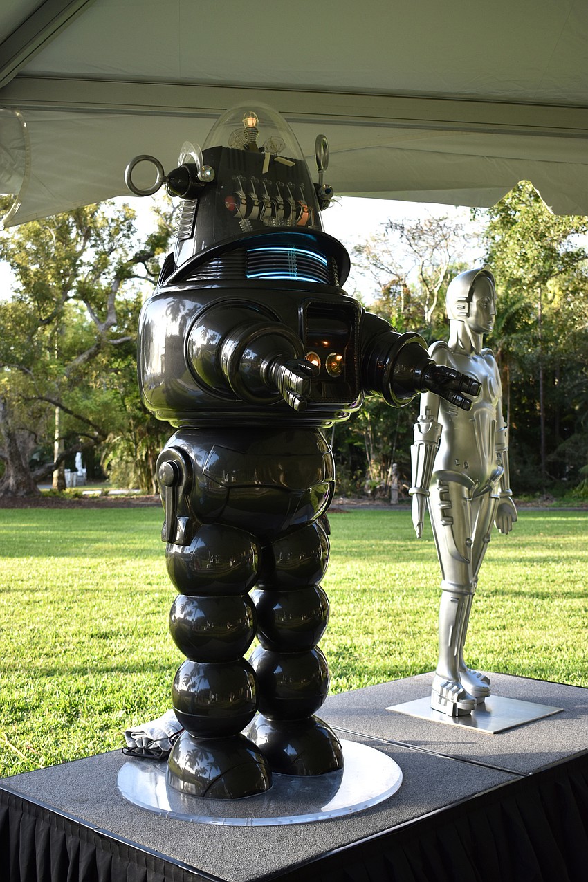 A music-playing robot and static silver statue created a futuristic vibe at the Technological Arts Pavilion.