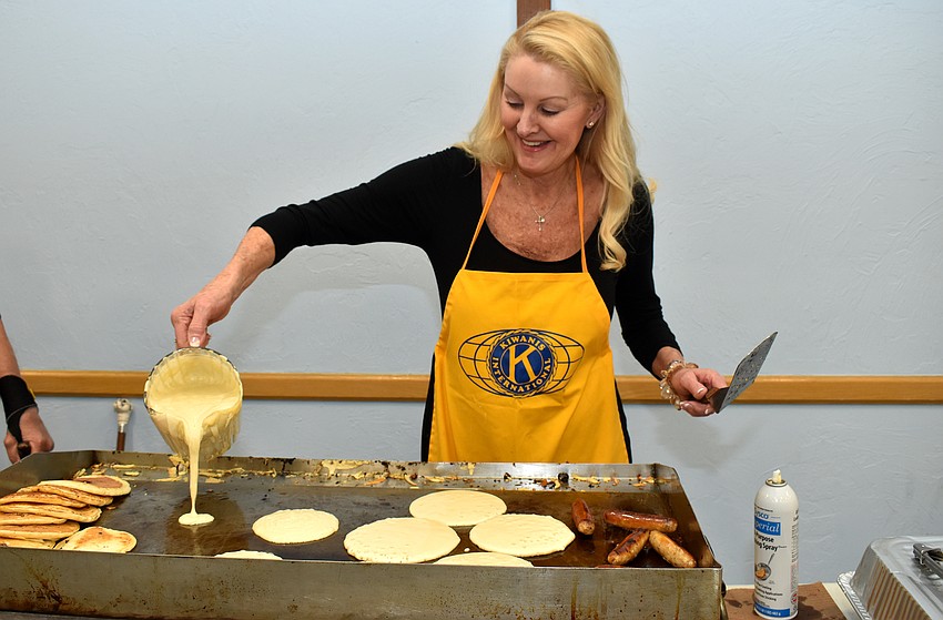 Susan Phillips is all smiles as she makes a batch of pancakes.