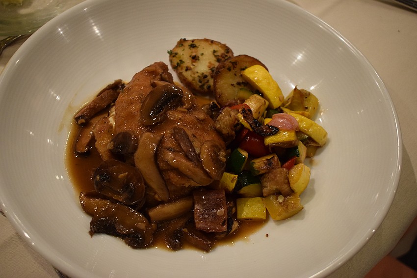 Guests enjoy a meal prepared by Michael's on East.