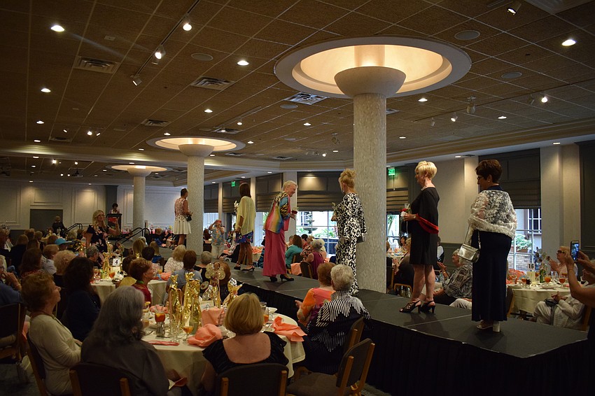 As the fashion show concluded, all the women took the stage for the last time in the third and final ensembles.