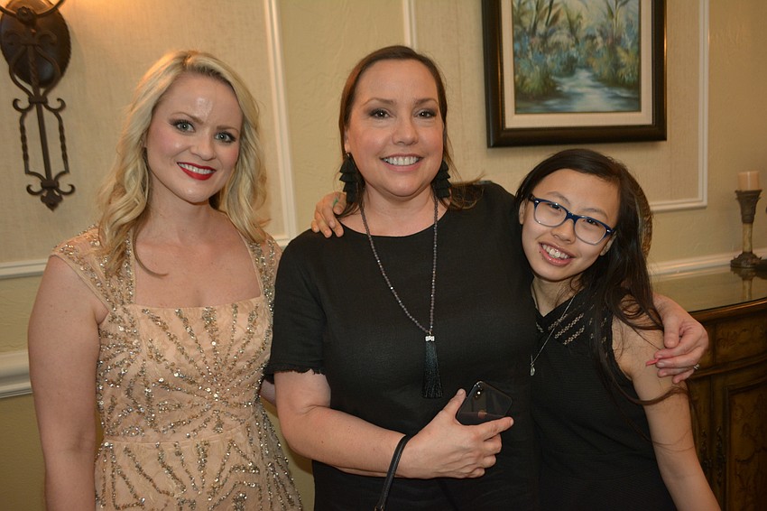 Sarasota performer Yohanna Fincher visits with her new fans, Sarasota's Carol and Grace Grogan.