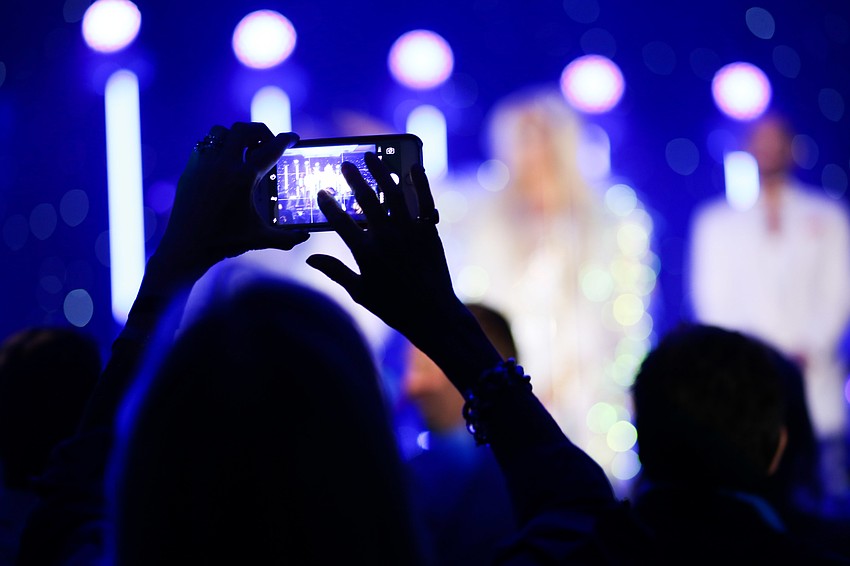 Guests took videos and live feeds on their phones of the concert.