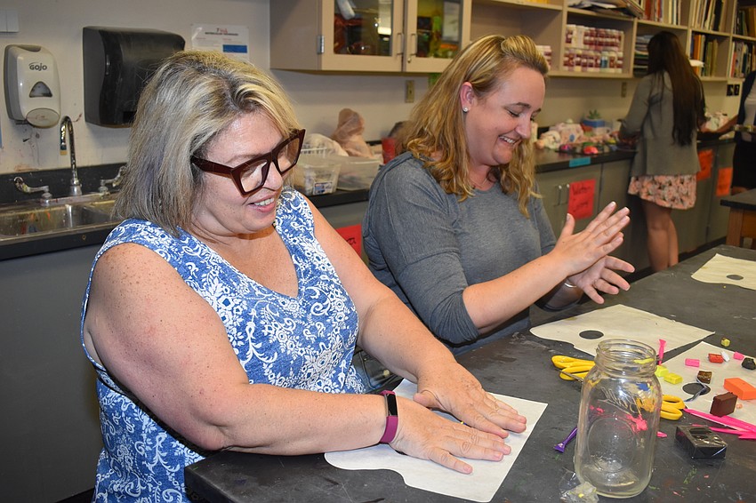 Maria Savino and Danielle Holdway make crafts in the Masterclass.