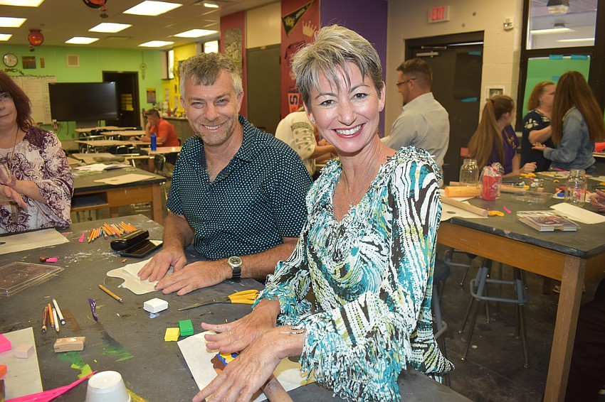 Jesse White and Diane Lawson are parents of children in the VPA program, learning about how to do art projects.