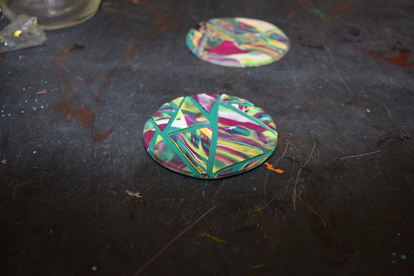 The parents made small coins during their masterclass.