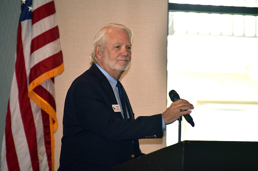 Longboat Key Democratic Club President Ken Marsh welcomes the crowd.