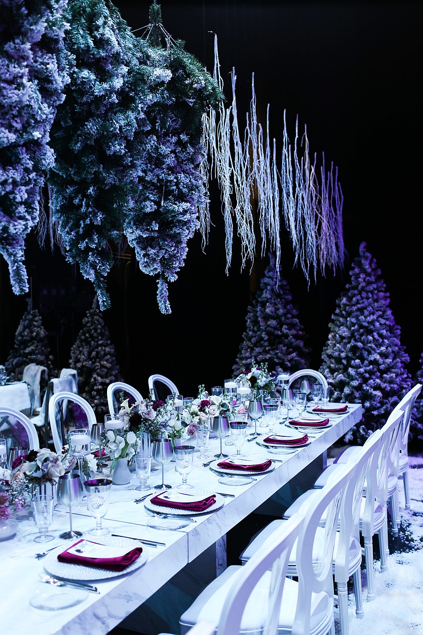 Evergreen trees and branches hung from the ceiling.