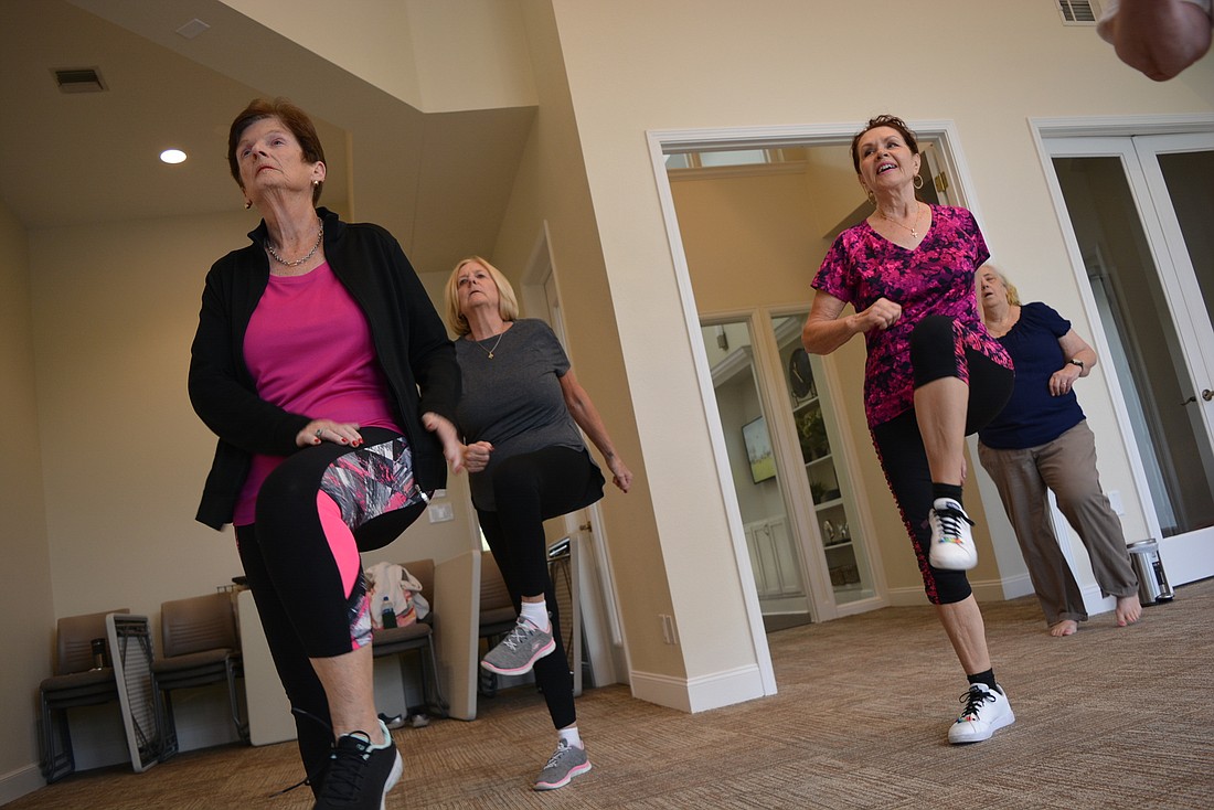 Riverwalk&#39;s Linda Carroll and River Club&#39;s  Penny Savage like doing low impact exercises in a group setting because they have fun while they work out.
