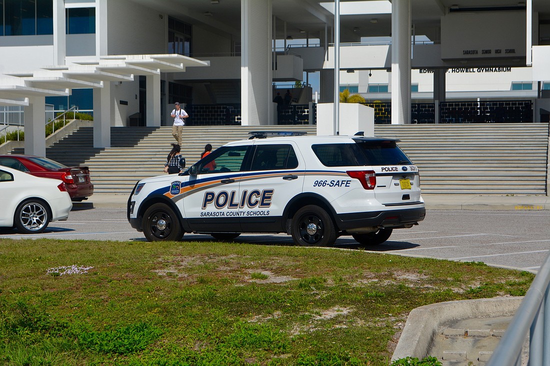 A Sarasota County Schools Police Department vehicle sits outside of Sarasota High School.