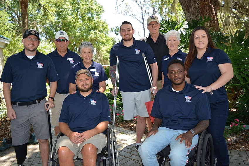 Clockwise from left: veteran Bobby Withers, Jim and Deb Kehoe, veteran Stephen Peterson, John and Kathi Skelton, Ashley Nickles, veteran Michael Monthervil and veteran Carl Moore.