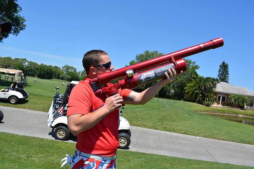 David Schappacher tries the air gun at Hole 10 rather than trying to hit the ball far.