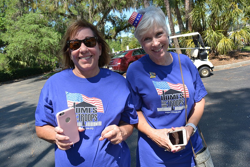 Volunteers Lynn Toscano manned the silent auction and Jenny Goodenow helped with registration.