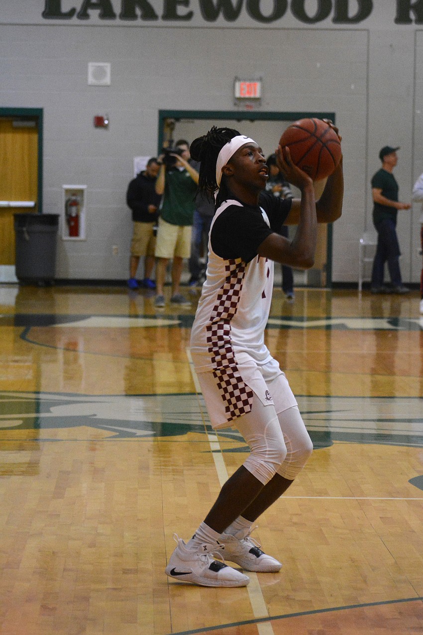 Braden River's Lonnie Brown takes a 3-pointer.