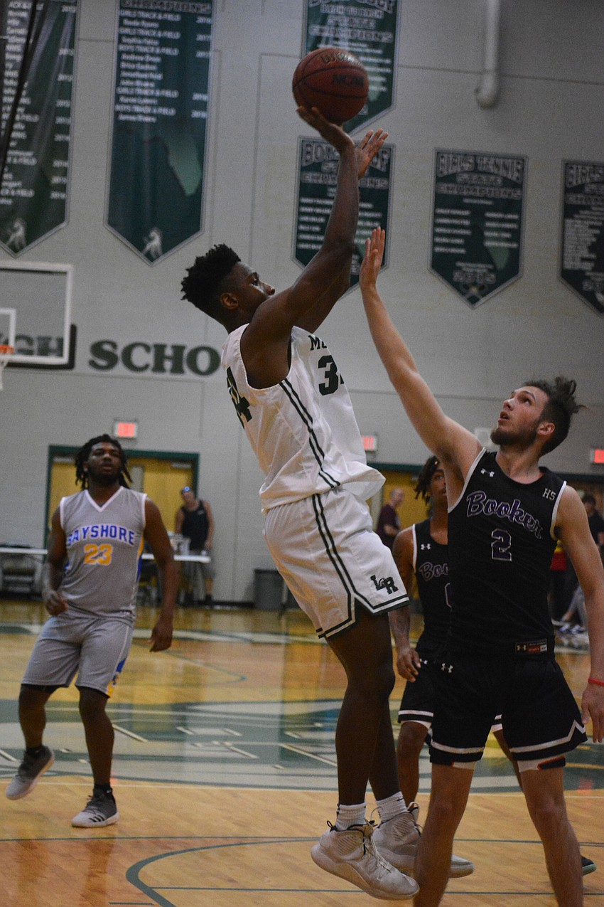 Lakewood Ranch's Josh Young hits a fadeaway jumper over Booker's Hudson Gough.