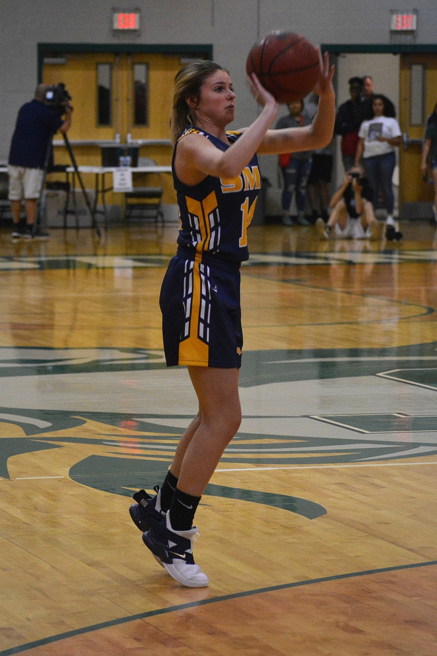 SMA's Emma Burg hits an outside shot.