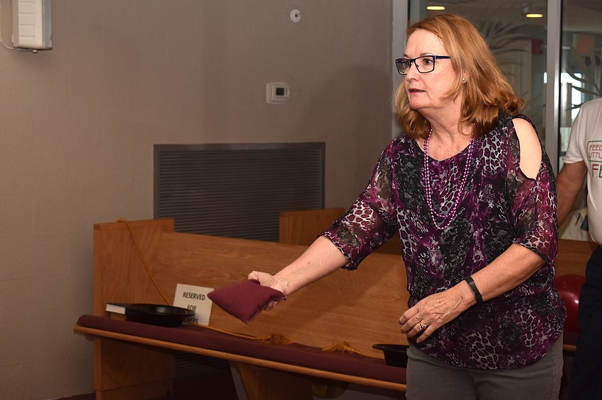 Melody Nelson plays cornhole.