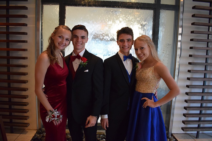 Junior Kyra Rouse, senior Nick Josephson, senior Gavin Pavkovich, and junior Hana Tomik were all smiles as they walked into their prom.