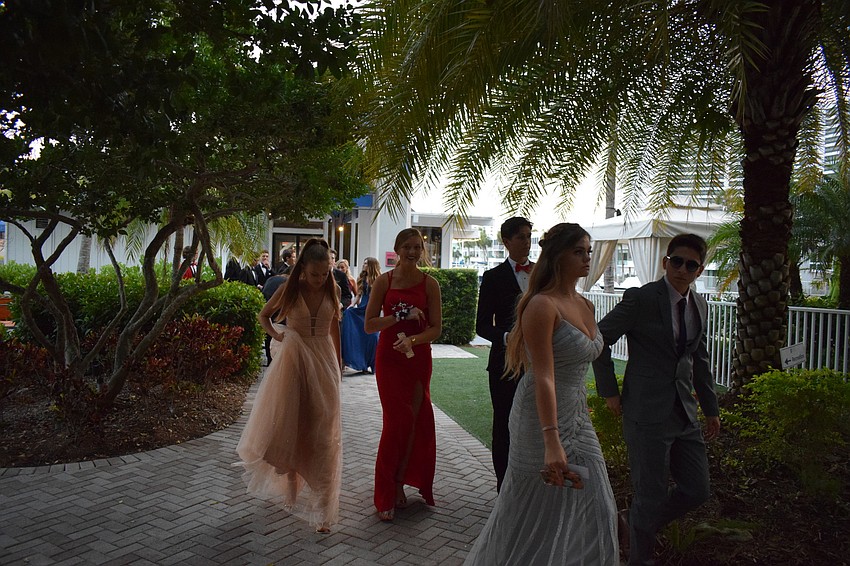 Excited students head to their prom.