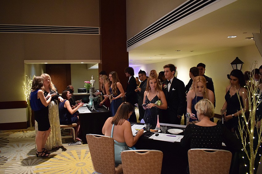 Student staff members worked diligently to get the students signed in and on to the festivities.