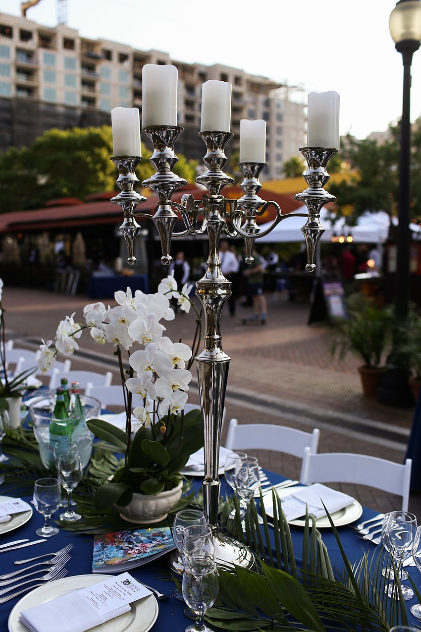 The table was decorated with orchids and candles.