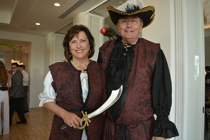 Susan and Tom Moseley brought Capt. Flint, a fake parrot, to the event.