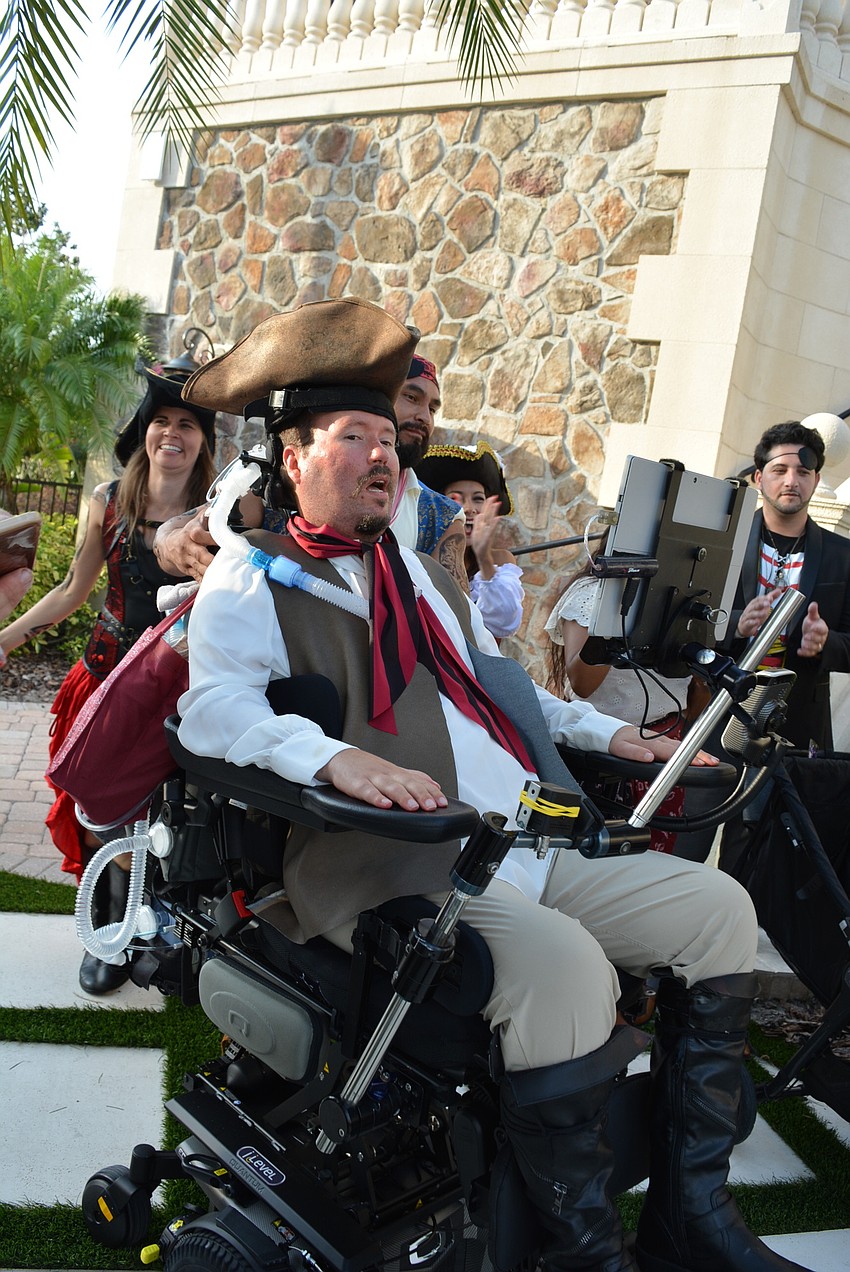 Kevin Swan makes his way through a cheering crowd for a picture.