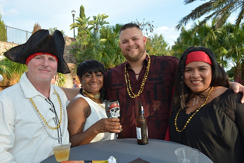 Ben Colburn, Vera Hawkins, Steve Farley and Nancy Moreno represent event sponsor Walmart.