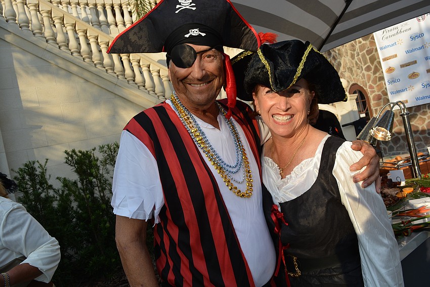 Sam and Patricia Sciturro have their eyes on a live auction item.