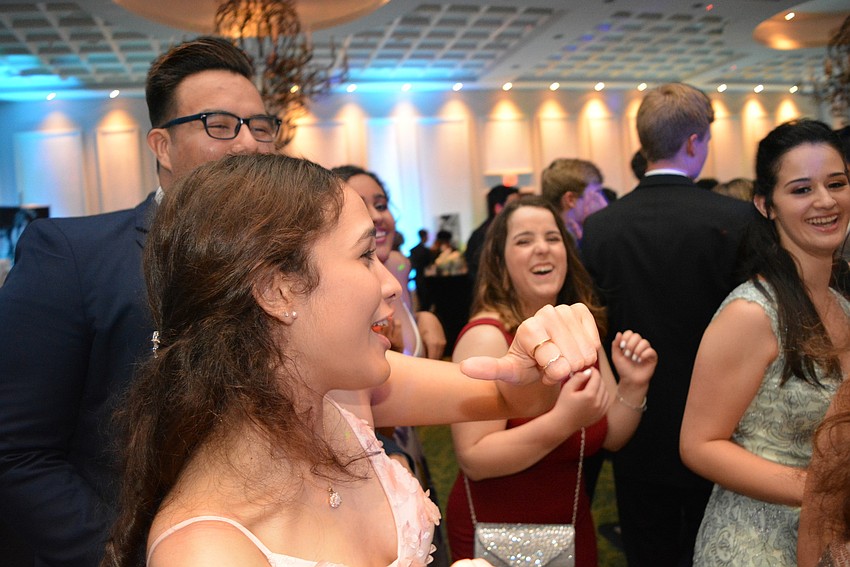 Debora Fernandez, front, shows her moves during the song, 